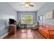Well-lit office space with hardwood floors, a ceiling fan, and large window at 21 Botanical Way, Pittsboro, NC 27312