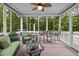 Relaxing screened porch featuring comfortable seating and a ceiling fan for added comfort at 21 Botanical Way, Pittsboro, NC 27312