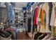 Organized walk-in closet with shelving and ample hanging space for clothing and accessories at 21 Botanical Way, Pittsboro, NC 27312