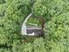 Aerial view of the roof of a house surrounded by green trees and foliage at 2300 Valley Forge Dr, Raleigh, NC 27615