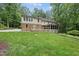 Exterior view from backyard featuring deck and screened in porch at 2300 Valley Forge Dr, Raleigh, NC 27615