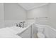 Clean bathroom featuring a built-in tub with faucet and a toilet at 2300 Valley Forge Dr, Raleigh, NC 27615