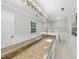 Bright bathroom featuring a granite countertop, large mirror, and good lighting at 2300 Valley Forge Dr, Raleigh, NC 27615
