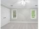 Bedroom featuring closet, windows with blinds, and carpet flooring at 2300 Valley Forge Dr, Raleigh, NC 27615
