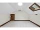 Attic bedroom featuring skylight and door at 2300 Valley Forge Dr, Raleigh, NC 27615