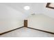 Attic bedroom features a skylight and neutral carpet at 2300 Valley Forge Dr, Raleigh, NC 27615