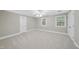 Bedroom offering windows, carpet flooring and closet at 2300 Valley Forge Dr, Raleigh, NC 27615