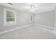 Bright bedroom with two windows providing natural light and carpet flooring at 2300 Valley Forge Dr, Raleigh, NC 27615