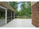 Open-air deck overlooks greenery, with screened-in porch visible at 2300 Valley Forge Dr, Raleigh, NC 27615