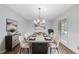 Dining room featuring bright light and seating for eight at 2300 Valley Forge Dr, Raleigh, NC 27615