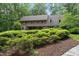 Brick home with manicured shrubs, showcasing the home's elegant architecture at 2300 Valley Forge Dr, Raleigh, NC 27615