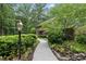 Brick home's exterior with a well-maintained landscape, creating a serene and inviting atmosphere at 2300 Valley Forge Dr, Raleigh, NC 27615