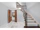 Inviting foyer featuring marble floors, staircase, and traditional design at 2300 Valley Forge Dr, Raleigh, NC 27615