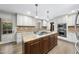 Open concept kitchen with large center island and stainless steel appliances at 2300 Valley Forge Dr, Raleigh, NC 27615