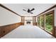 Bright living room with fireplace, built-in shelves, and scenic backyard view at 2300 Valley Forge Dr, Raleigh, NC 27615
