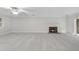 Bright living room with a fireplace and carpet flooring, offering a cozy and inviting space at 2300 Valley Forge Dr, Raleigh, NC 27615