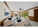 Inviting living room with fireplace, built-in shelves, and serene backyard view at 2300 Valley Forge Dr, Raleigh, NC 27615