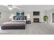 Spacious main bedroom boasts a fireplace, ceiling fan, and large windows offering plenty of natural light at 2300 Valley Forge Dr, Raleigh, NC 27615