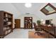 Home office with a skylight, built-in bookshelves, and traditional furnishings at 2300 Valley Forge Dr, Raleigh, NC 27615