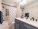 Stylish bathroom with double sink vanity, modern finishes, and a tub-shower combination at 2303 Byrd St, Raleigh, NC 27608