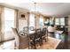 Elegant dining room with modern chandelier, hardwood floors and stylish chairs at 2303 Byrd St, Raleigh, NC 27608