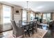 Open dining room with natural light, decorative curtains, and view to the living room at 2303 Byrd St, Raleigh, NC 27608