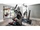 Well-equipped exercise room featuring modern fitness equipment and access to an outdoor seating area at 2303 Byrd St, Raleigh, NC 27608