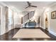 Spacious foyer showcasing dark wood floors, staircase, and modern decor at 2303 Byrd St, Raleigh, NC 27608