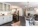 Modern kitchen with white cabinets, stainless steel appliances, and a center island at 2303 Byrd St, Raleigh, NC 27608