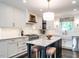 Bright, renovated kitchen with marble backsplash, stainless appliances, and a center island at 2303 Byrd St, Raleigh, NC 27608