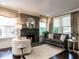 Comfortable living room with fireplace, neutral tones, and ample natural light at 2303 Byrd St, Raleigh, NC 27608