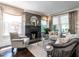 Cozy living room with fireplace, natural light, and comfortable seating at 2303 Byrd St, Raleigh, NC 27608
