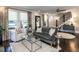 Open-concept living room with a fireplace, staircase and ample seating at 2303 Byrd St, Raleigh, NC 27608