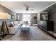 Stylish living room featuring a large sectional sofa, decorative accents, and ceiling fan at 2303 Byrd St, Raleigh, NC 27608
