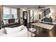 Bright living room with a staircase, dark wood floors and stylish decor at 2303 Byrd St, Raleigh, NC 27608