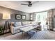 Inviting living room with a comfortable sectional sofa, elegant decor, and lots of light at 2303 Byrd St, Raleigh, NC 27608