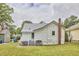View of backyard showcasing the property's exterior and landscaping at 2418 Highland Ave, Durham, NC 27704