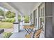 Inviting front porch with seating, gray trim, and ample space for relaxation at 2418 Highland Ave, Durham, NC 27704