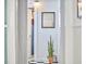 Hallway featuring checkered floors, potted plants and natural light at 2418 Highland Ave, Durham, NC 27704
