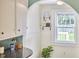 Bright kitchen nook featuring natural light, shelving and modern decor at 2418 Highland Ave, Durham, NC 27704