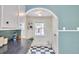 Bright kitchen with white cabinets, a view to the outdoors and black and white floors at 2418 Highland Ave, Durham, NC 27704