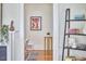 Open living area featuring hardwood floors and artistic decor with an indoor plant at 2418 Highland Ave, Durham, NC 27704