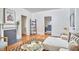 Bright living room with fireplace, seamlessly connecting to an adjacent bedroom at 2418 Highland Ave, Durham, NC 27704
