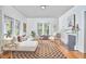 Bright living room with hardwood floors, fireplace, and ample seating perfect for gatherings at 2418 Highland Ave, Durham, NC 27704