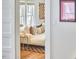 Living room visible through a doorway with hardwood floors and modern furniture at 2418 Highland Ave, Durham, NC 27704