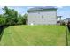 Expansive, fenced backyard with an easy access basement entrance and lots of green space at 2636 Nordmann Fir Rd, Raleigh, NC 27616
