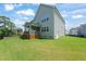 Large, fenced backyard with a deck and screened-in porch, perfect for outdoor activities at 2636 Nordmann Fir Rd, Raleigh, NC 27616