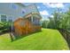Well-manicured backyard with a wooden deck, screened porch, and a lush lawn at 2636 Nordmann Fir Rd, Raleigh, NC 27616