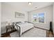 Bedroom with hardwood floors, a day bed, a gray area rug, and natural light from the window at 2636 Nordmann Fir Rd, Raleigh, NC 27616