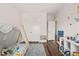 Bright bedroom showcasing a tented bed, hardwood floors, and whimsical wall decorations, perfect for a  at 2636 Nordmann Fir Rd, Raleigh, NC 27616
